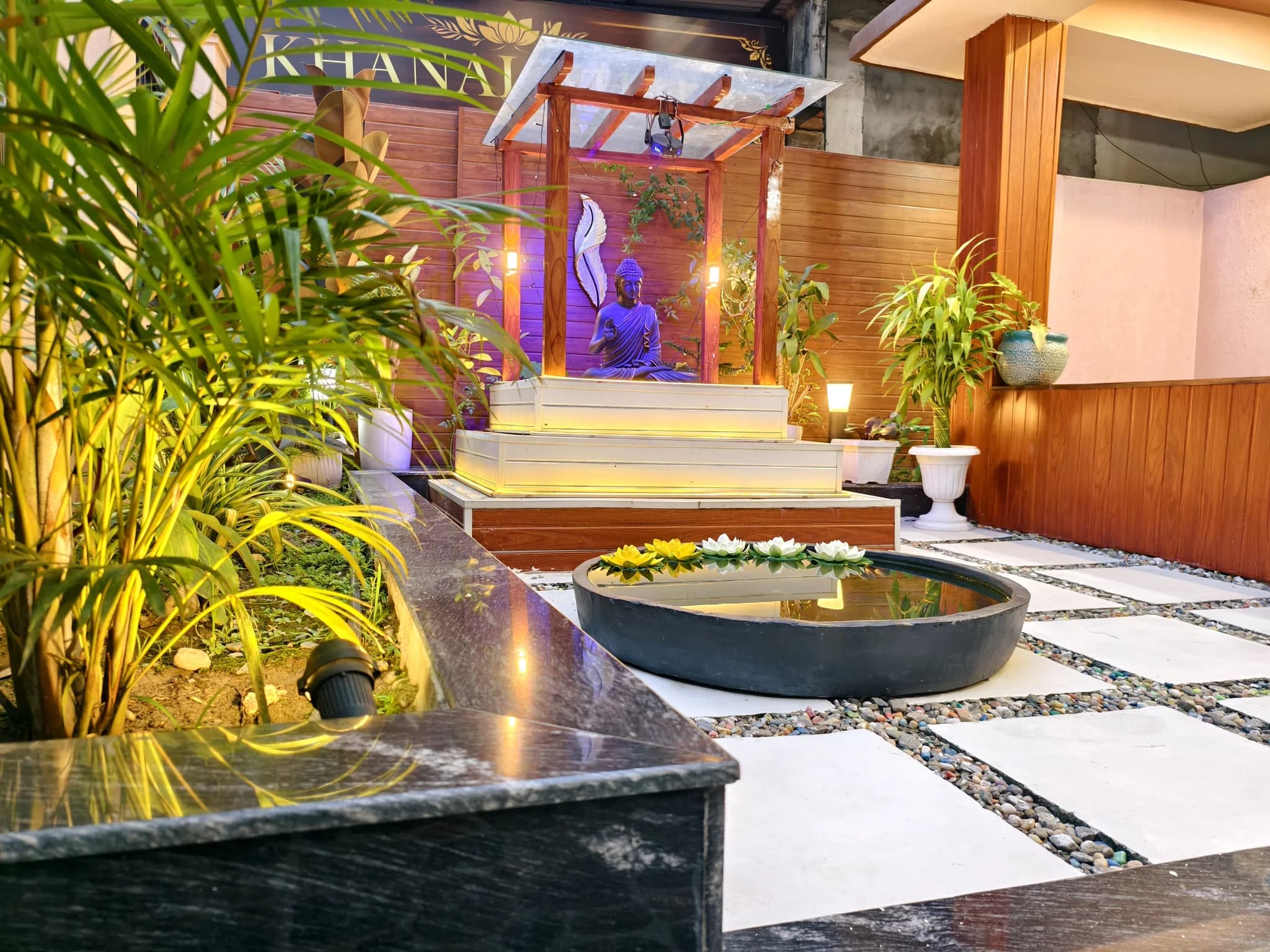 Zen garden Buddha shrine with lotus pond