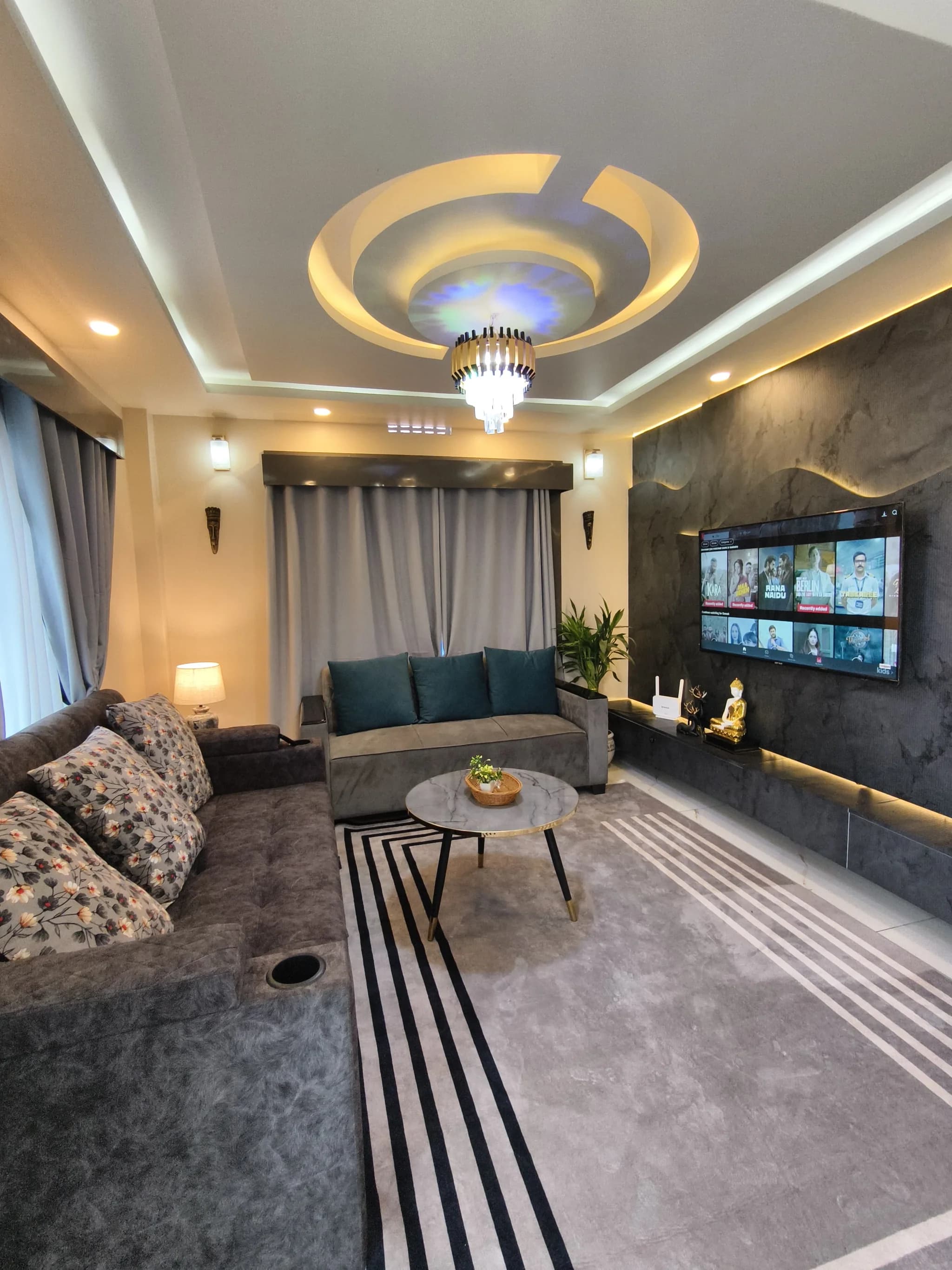 Marble-clad living area with ambient lighting at Omnia Luxe Villa