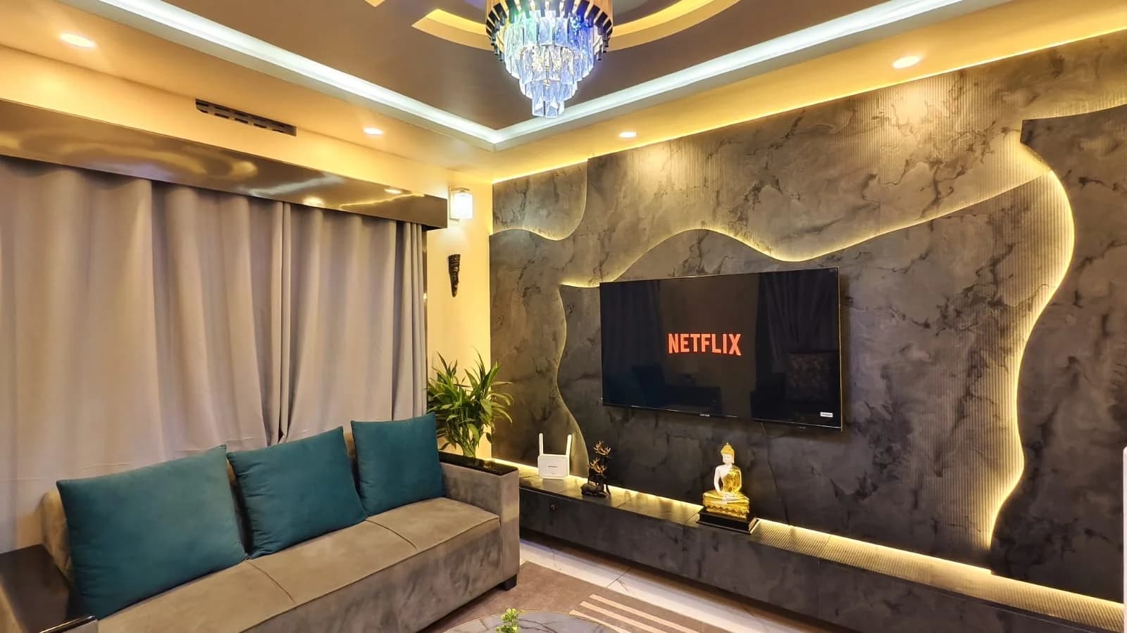 Living room with sculpted backlit stone media wall